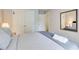 Guest bedroom with mirrored closet doors, comfortable bedding, and soft lighting at 3099 Regency Park Dr, Lithonia, GA 30038