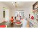 Dining room with a round table, chandelier, and views into the living room, decorated with elegant tableware at 3099 Regency Park Dr, Lithonia, GA 30038