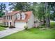 Charming home with a two car garage and manicured lawn at 3099 Regency Park Dr, Lithonia, GA 30038