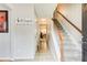 Entry hallway leading to staircase featuring tiled floors, neutral colors, and natural light at 3099 Regency Park Dr, Lithonia, GA 30038