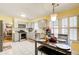 Bright kitchen featuring stainless steel appliances, gray cabinetry, white countertops, and a dining nook at 3099 Regency Park Dr, Lithonia, GA 30038