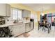 Modern kitchen showcasing stainless steel appliances, gray cabinetry, white countertops, and a tiled backsplash at 3099 Regency Park Dr, Lithonia, GA 30038