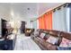 Inside the cozy sunroom featuring neutral colors, leather sofa and bright curtains, offering a relaxing retreat at 3099 Regency Park Dr, Lithonia, GA 30038