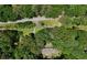 Aerial view of a home surrounded by lush greenery and trees at 544 W Macedonia Church Rd, Oxford, GA 30054