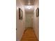 Hallway with hardwood floors and neutral paint at 544 W Macedonia Church Rd, Oxford, GA 30054