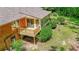 Aerial view of the rear deck, the screened in porch, and brick exterior at 544 W Macedonia Church Rd, Oxford, GA 30054