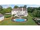 Private backyard featuring an in-ground pool, spacious deck, and manicured lawn perfect for outdoor entertaining at 1481 Highway 85 Connector, Brooks, GA 30205
