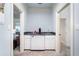 Home bar area features white cabinets, dark counters, and stainless steel mini-fridge at 1481 Highway 85 Connector, Brooks, GA 30205