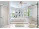 Bright bathroom features a glass enclosed shower and a large garden tub at 1481 Highway 85 Connector, Brooks, GA 30205