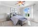 Well lit bedroom with neutral colors, ceiling fan, large bed, and natural light at 1481 Highway 85 Connector, Brooks, GA 30205