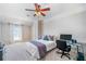 Simple bedroom featuring a bed, computer desk, and large window at 1481 Highway 85 Connector, Brooks, GA 30205
