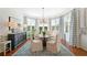 Formal dining room with elegant furnishings, hardwood floors, and natural light for memorable gatherings at 1481 Highway 85 Connector, Brooks, GA 30205