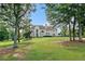 Beautiful home with a lush front lawn and mature trees, offering curb appeal and a tranquil setting at 1481 Highway 85 Connector, Brooks, GA 30205