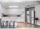 Eat-in kitchen features white cabinets and stainless steel appliances at 1481 Highway 85 Connector, Brooks, GA 30205