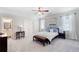 Bright main bedroom with carpet, ceiling fan, ensuite, and walk-in closets at 1481 Highway 85 Connector, Brooks, GA 30205