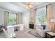 Bright home office with white desk, chair and a comfortable recliner at 1481 Highway 85 Connector, Brooks, GA 30205