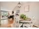 Dining area featuring a round table, modern light fixture, and an open view to the living room at 2336 Vistamont Dr, Decatur, GA 30033