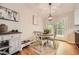 Bright dining area with a round table, hardwood floors, and access to the outdoor deck at 2336 Vistamont Dr, Decatur, GA 30033