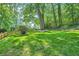 Expansive, well-manicured front lawn with mature trees and a charming picket fence at 2336 Vistamont Dr, Decatur, GA 30033