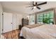 Main bedroom features hardwood floors, ceiling fan, ensuite, and ample closet space at 2336 Vistamont Dr, Decatur, GA 30033