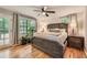 Main bedroom features hardwood floors, natural light, ceiling fan, and ensuite at 2336 Vistamont Dr, Decatur, GA 30033