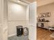 A stylish mudroom with decorative tile flooring, accent wall, and bi-fold door storage space at 2336 Vistamont Dr, Decatur, GA 30033