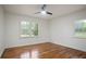 Bedroom with hardwood floors, neutral color palette, and a modern ceiling fan at 3480 Mount Olive Rd, Atlanta, GA 30344
