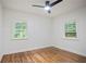 A light-filled bedroom with hardwood floors and bright white walls at 3480 Mount Olive Rd, Atlanta, GA 30344