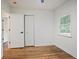 Bedroom with hardwood flooring, a closet, and natural light from the window at 3480 Mount Olive Rd, Atlanta, GA 30344