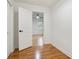 Empty bedroom with hardwood floors, white trim and fan light at 3480 Mount Olive Rd, Atlanta, GA 30344