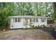 Charming, freshly painted brick home with a new door, updated landscaping, and lots of curb appeal at 3480 Mount Olive Rd, Atlanta, GA 30344