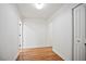 Bright hallway with multiple doorways, white trim, and hardwood floors at 3480 Mount Olive Rd, Atlanta, GA 30344