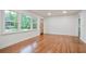 Spacious living room with hardwood floors, freshly painted walls, and updated lighting fixtures at 3480 Mount Olive Rd, Atlanta, GA 30344