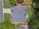 Aerial view of a home featuring a gray shingle roof, patio, and manicured landscaping at 350 Medridge Dr, Johns Creek, GA 30022