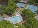 Community pool and tennis courts nestled among mature trees at 350 Medridge Dr, Johns Creek, GA 30022