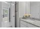 Bathroom featuring a granite countertop, sink, and decorative flower arrangement at 350 Medridge Dr, Johns Creek, GA 30022