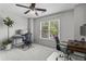 Bright bedroom features carpet, ceiling fan and a large window providing natural light, perfect for a home office at 350 Medridge Dr, Johns Creek, GA 30022