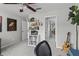 Bedroom features carpet, shelving, and is decorated with a large art piece and guitar at 350 Medridge Dr, Johns Creek, GA 30022