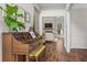 Entryway showcases a decorative piano and views to the living room with fireplace and shiplap accent wall at 350 Medridge Dr, Johns Creek, GA 30022