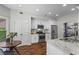 Modern kitchen featuring stainless steel appliances, granite countertops, and hardwood floors at 350 Medridge Dr, Johns Creek, GA 30022