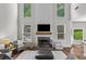 Bright living room with a fireplace, large windows, and high ceilings at 350 Medridge Dr, Johns Creek, GA 30022