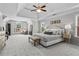 Spacious main bedroom featuring a tray ceiling, plush carpet, and ample natural light at 350 Medridge Dr, Johns Creek, GA 30022