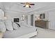Elegant main bedroom featuring a tray ceiling, fireplace, and an en-suite bathroom at 350 Medridge Dr, Johns Creek, GA 30022