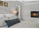 Relaxing main bedroom showcasing a cozy fireplace with tile surround at 350 Medridge Dr, Johns Creek, GA 30022