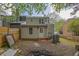 View of the backyard showing the exterior of the home surrounded by a fence and foliage at 3571 Kennesaw Station Nw Dr, Kennesaw, GA 30144
