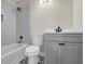 Stylish bathroom showcasing modern tiles, gray vanity and contemporary fixtures at 3571 Kennesaw Station Nw Dr, Kennesaw, GA 30144