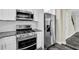 Updated kitchen featuring stainless steel appliances and white cabinetry at 3571 Kennesaw Station Nw Dr, Kennesaw, GA 30144