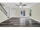 Cozy living room featuring wood-look floors, a ceiling fan, and staircase at 3571 Kennesaw Station Nw Dr, Kennesaw, GA 30144
