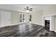 Bright living room with natural light, ceiling fan, and decorative fireplace at 3571 Kennesaw Station Nw Dr, Kennesaw, GA 30144