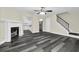 View of the living room with a decorative fireplace and open access to the kitchen at 3571 Kennesaw Station Nw Dr, Kennesaw, GA 30144